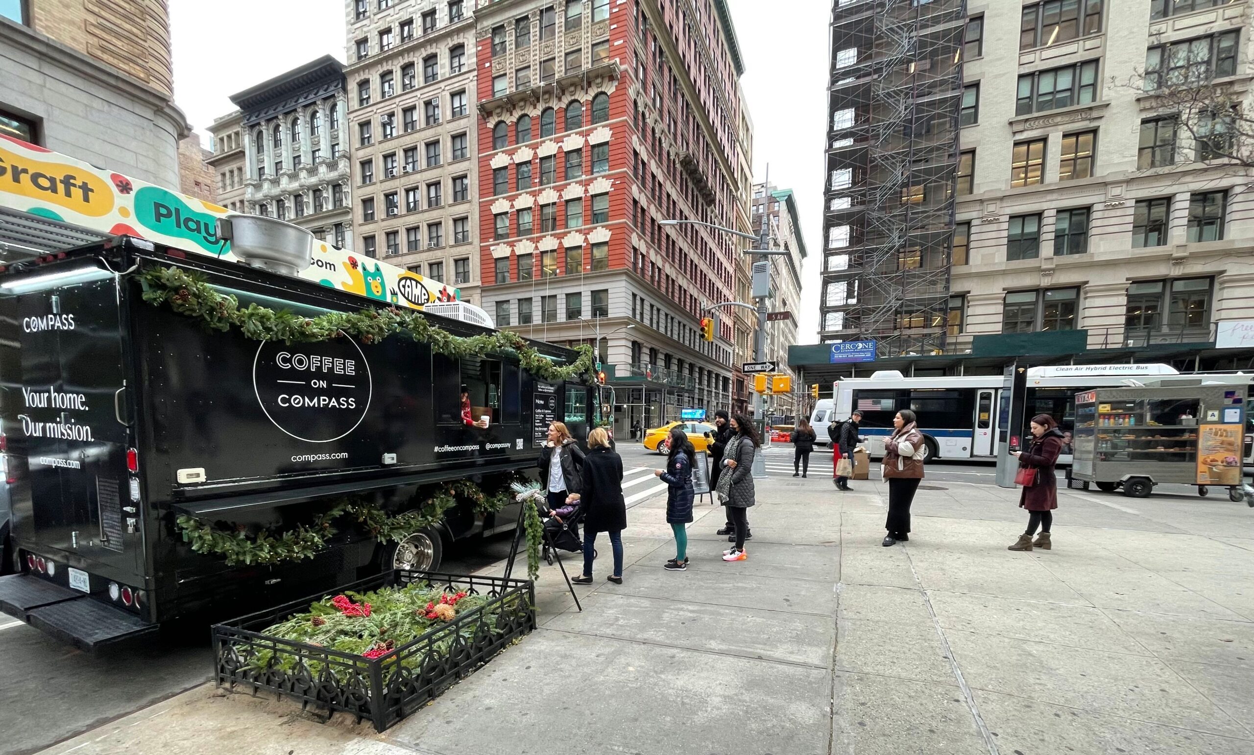 Compass handing out coffee in NYC