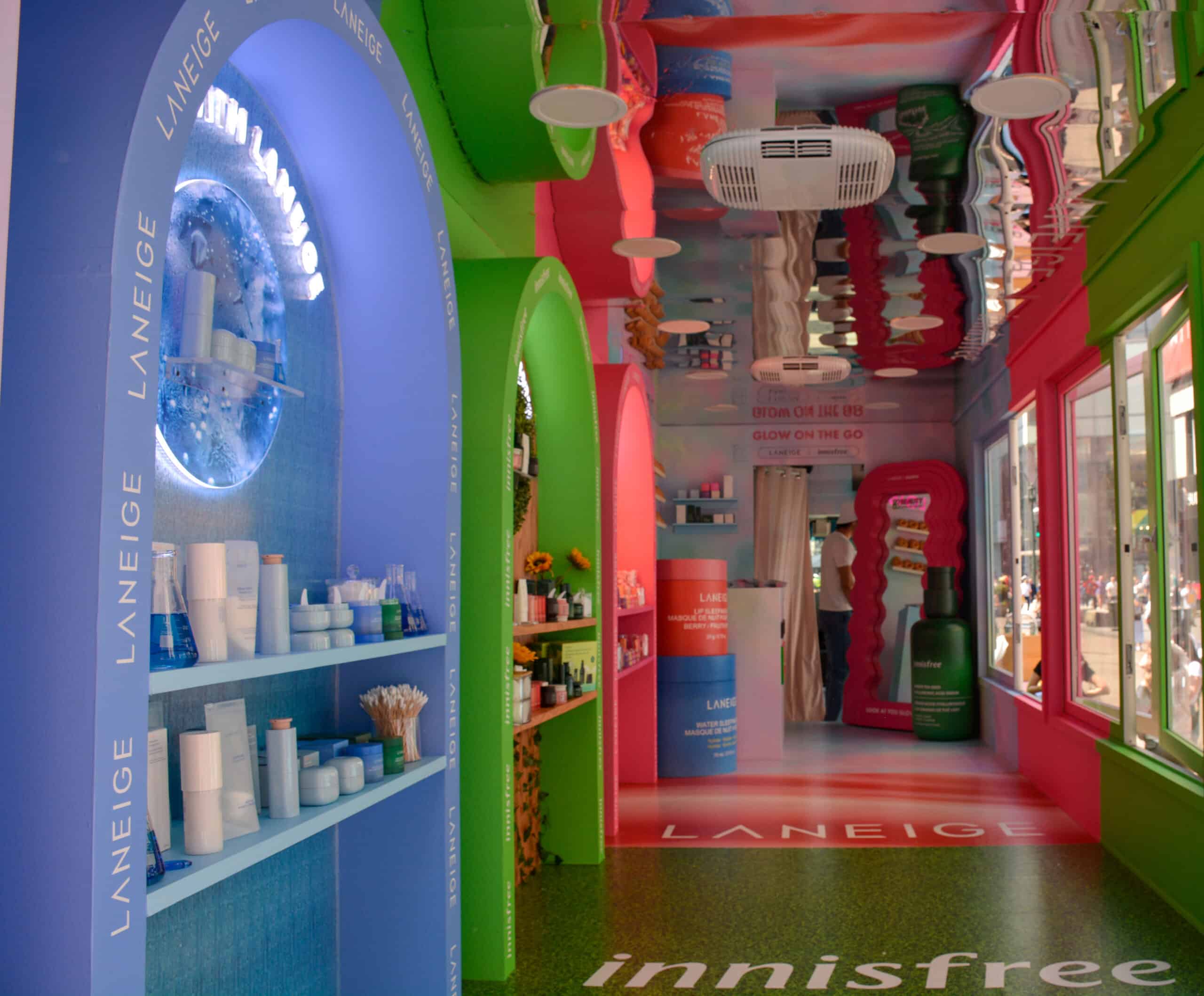 Glass Box Truck interior with blue and pink arches, skincare shelves, LANEIGE and innisfree logos.
