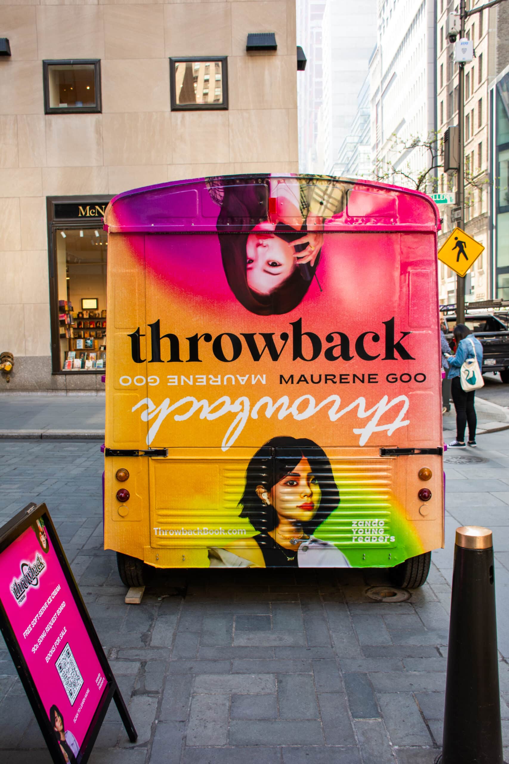 Citroens van with "Throwback" promo art, showing two women on a city street by a sidewalk sign.