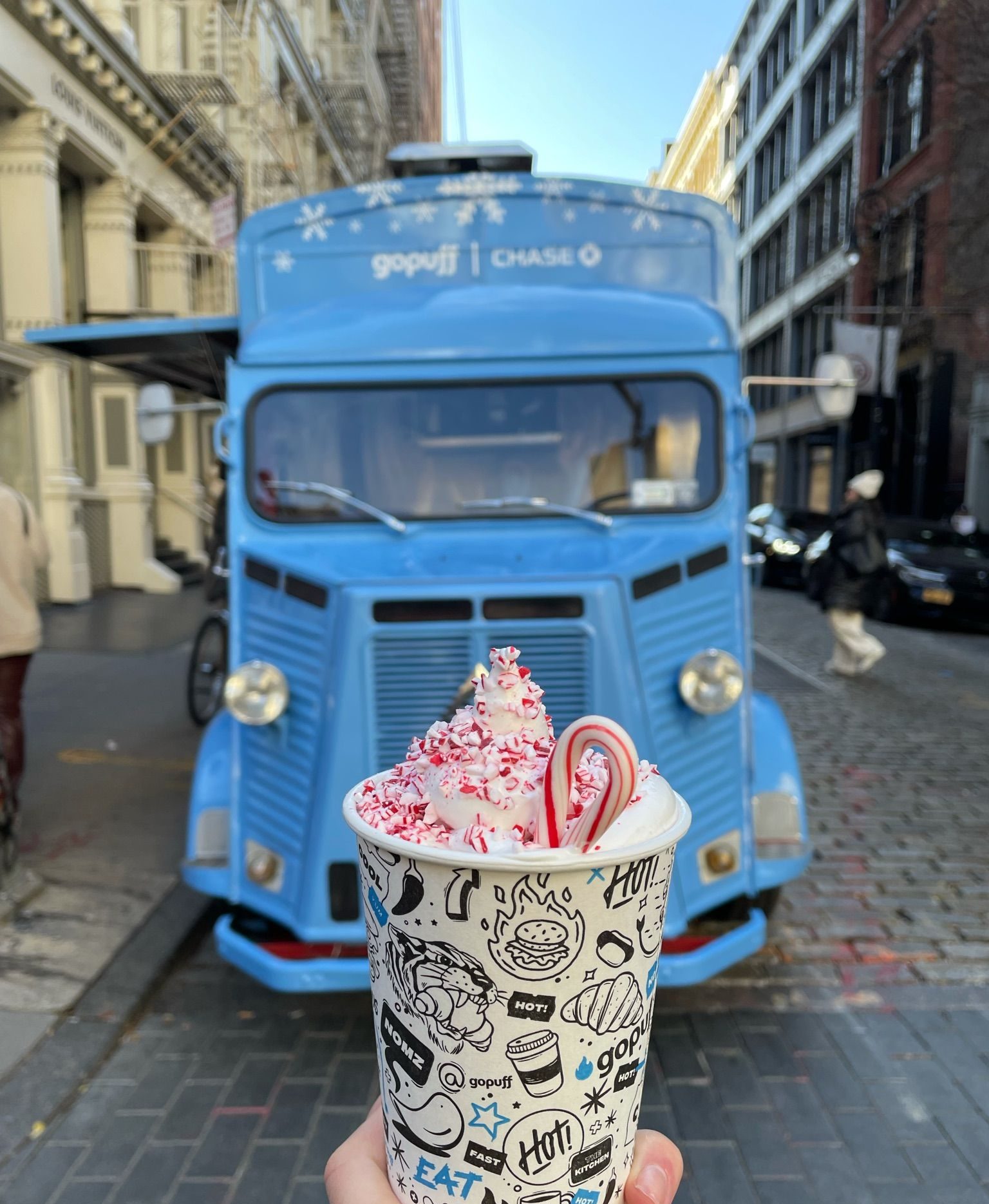 Gopuff using branded food truck to give away peppermint hot-chocolate for guerrilla marketing campaign.