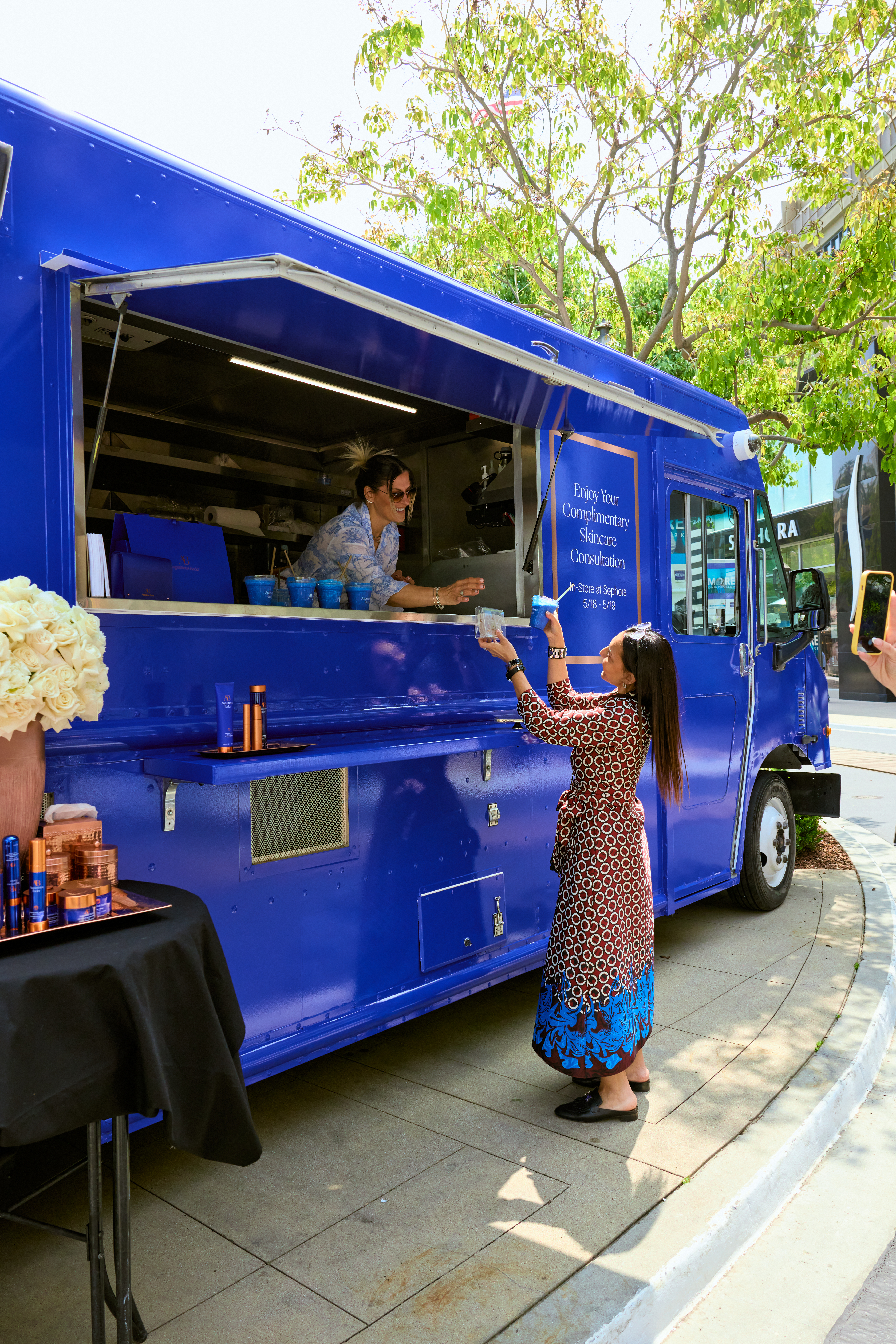 Augustinus Bader Pop-Up Truck Smoothies being served from the Augustinus Bader pop up truck at an outdoor mall in LA.