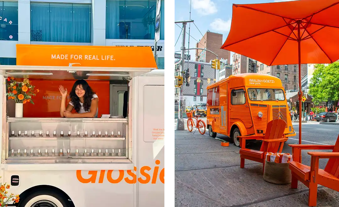 Split image: Left side shows a woman waving from inside an orange Glossier truck with product shelves. Right side shows an orange truck, table, chairs, and umbrella set up on a city sidewalk.