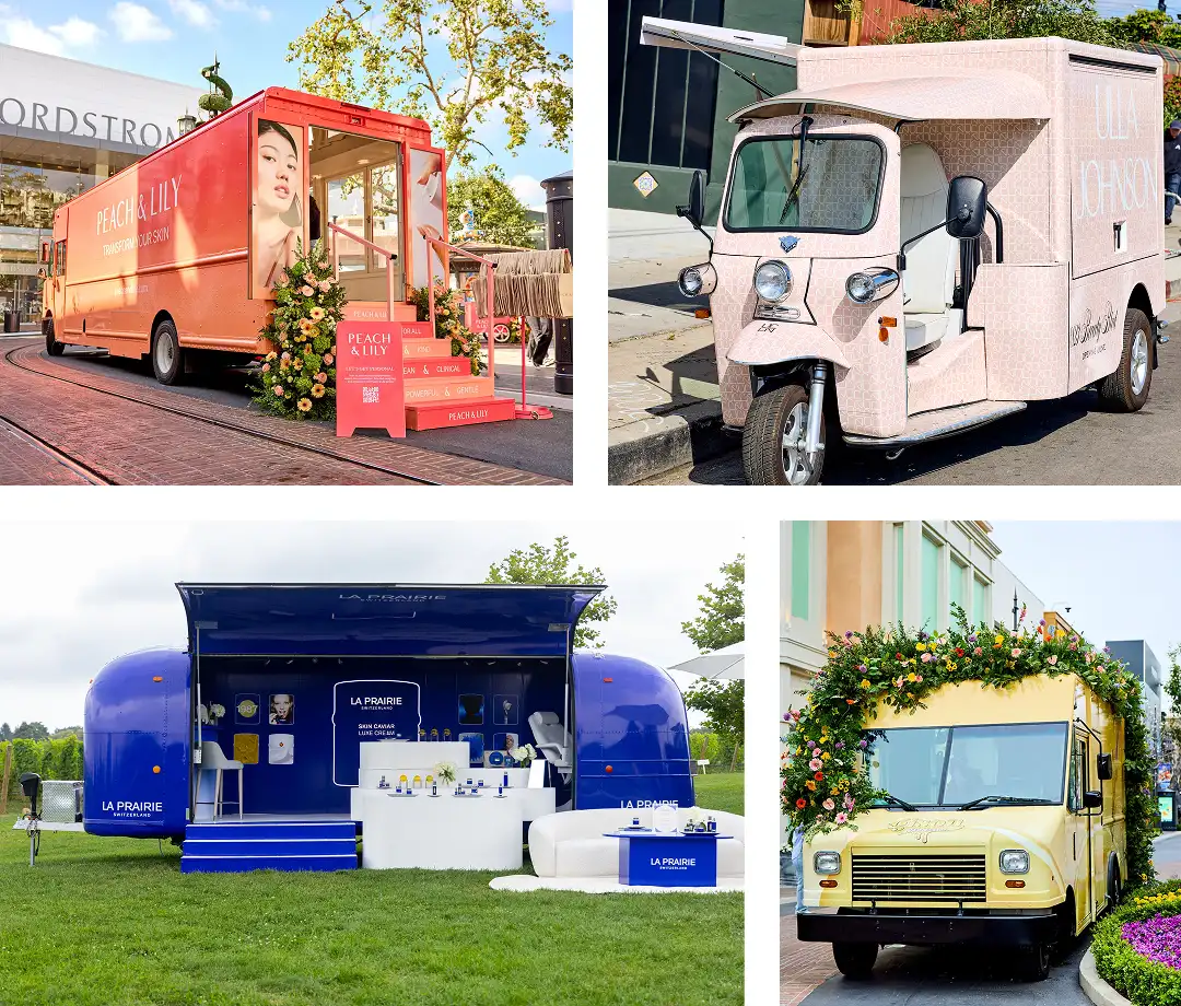 A collage of four colorful branded trucks and vans, each decorated for beauty product promotions. One features floral garlands, another displays a large model's face, and all are set up as mobile pop-up shops outdoors.