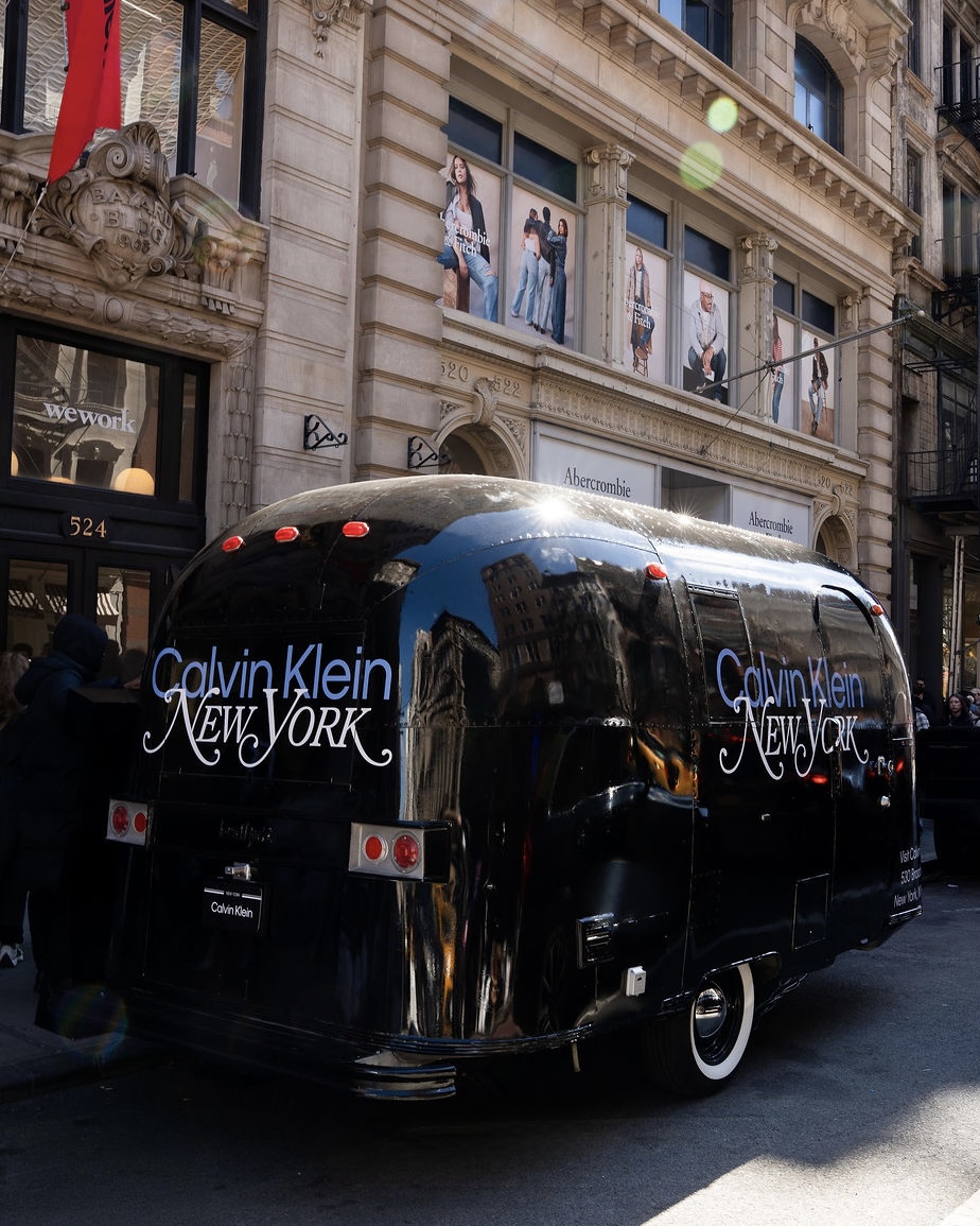 Calvin Klein New York trailer parked on a city street near Abercrombie & Fitch and wework.