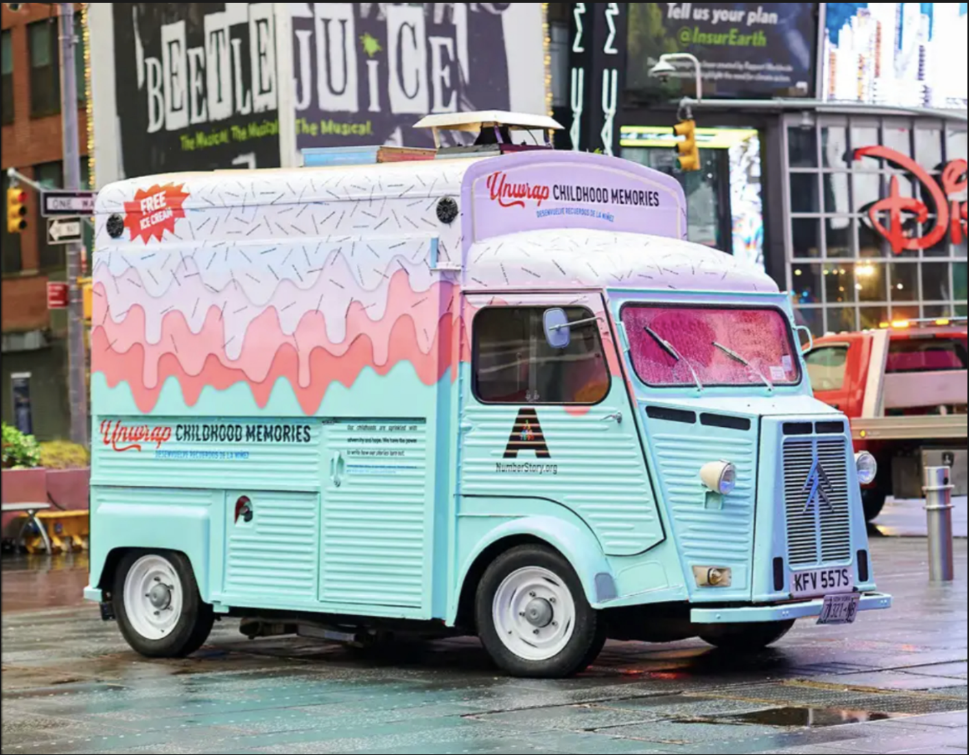 A branded promotional truck on a city street